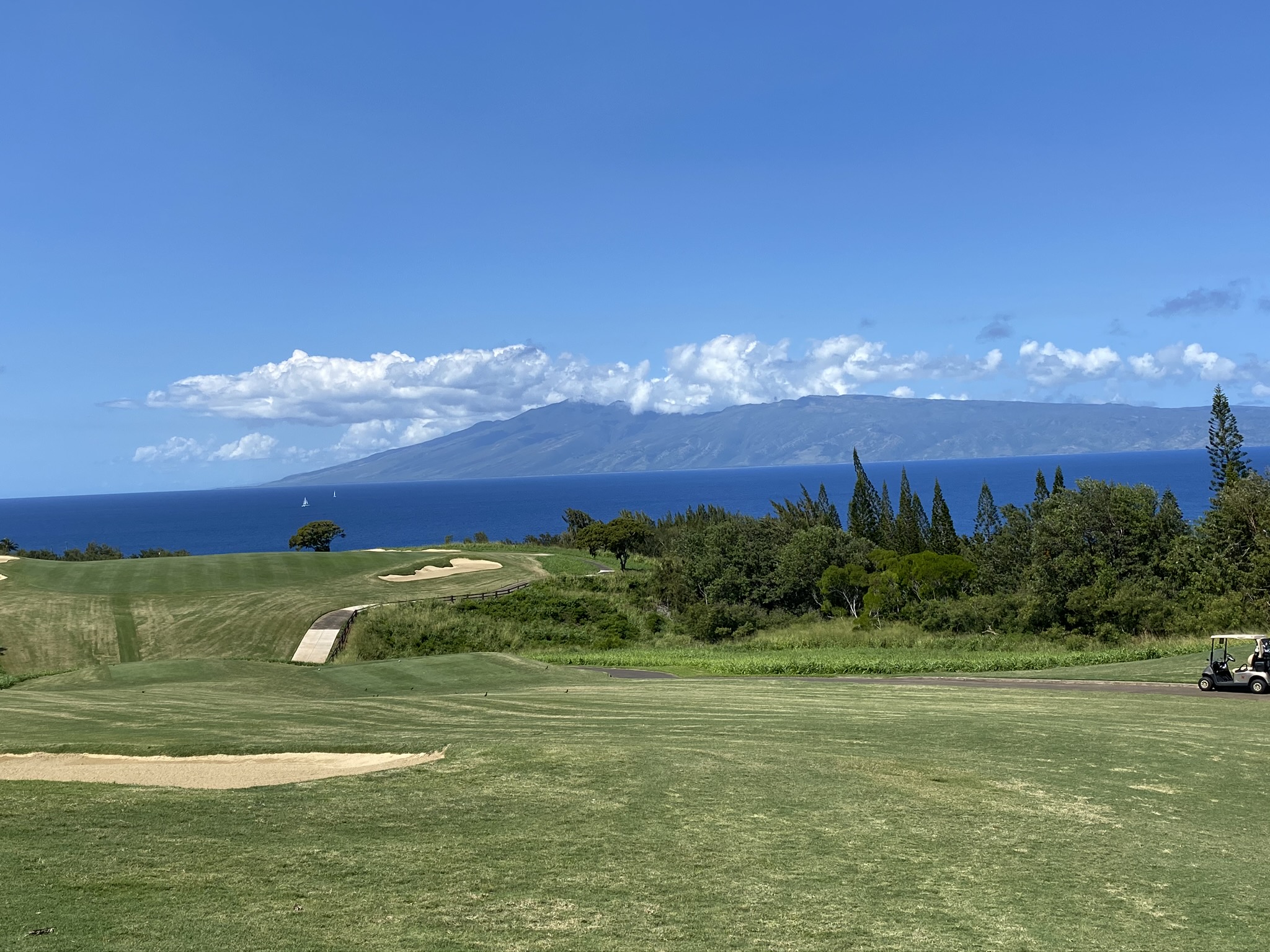 beautiful view of golf course with molokai island in the background