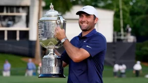 Scottie Scheffler hoists the Wanamaker Trophy at the 2025 PGA Championship